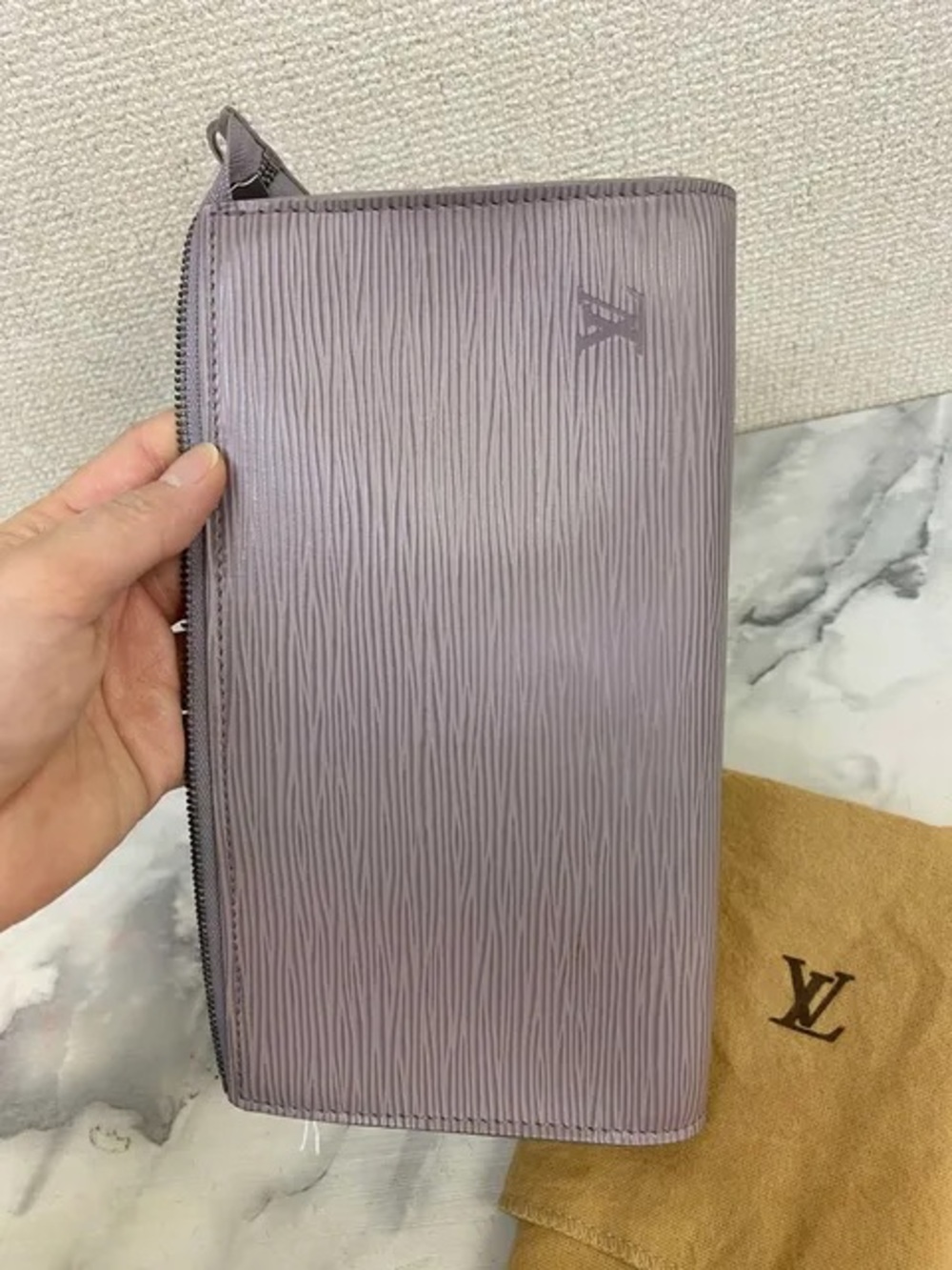 vintage Louis Vuitton Epi Pochette in a lilac or light purple leather